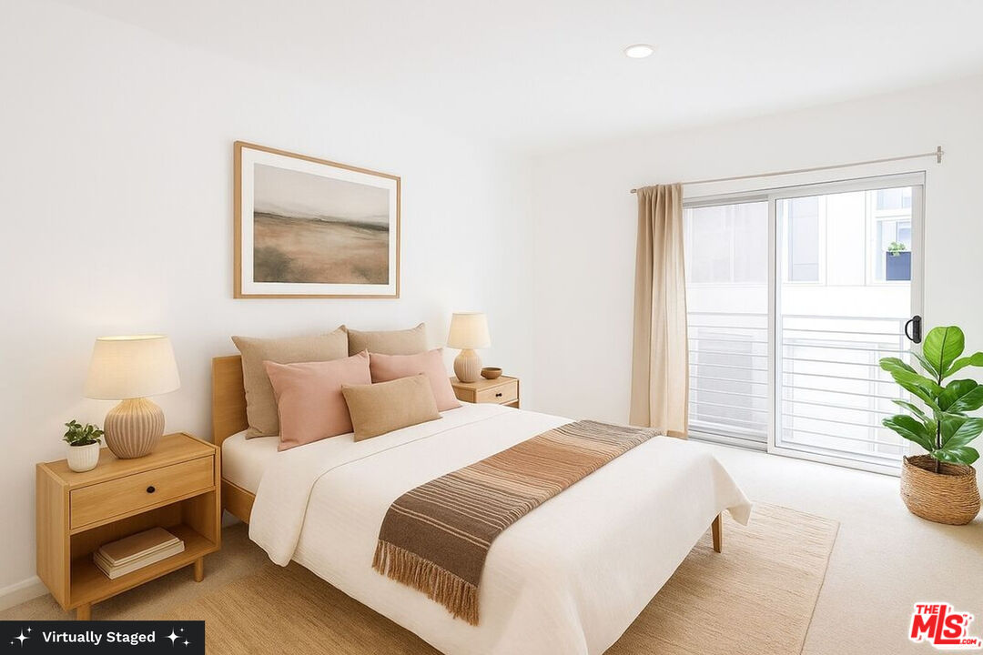 3119 Vía Dolce, Unit 302 Marina del Rey, CA 90292 - Photo 3 of 22 a bedroom with a bed and a potted plant