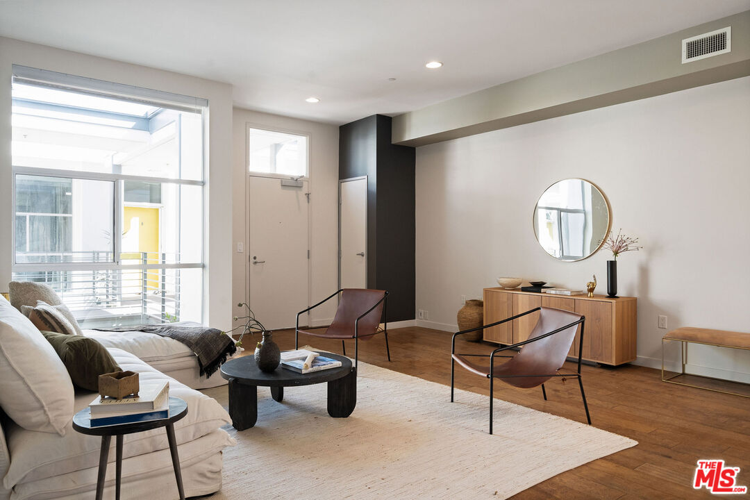3119 Vía Dolce, Unit 302 Marina del Rey, CA 90292 - Photo 10 of 22 a living room with furniture and a window