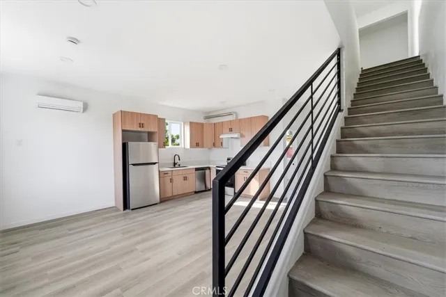 a view of hallway with wooden floor