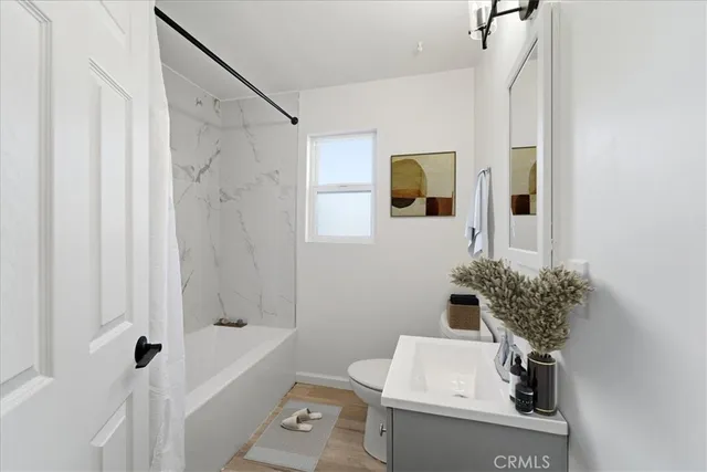 a bath room with a sink and a bath tub