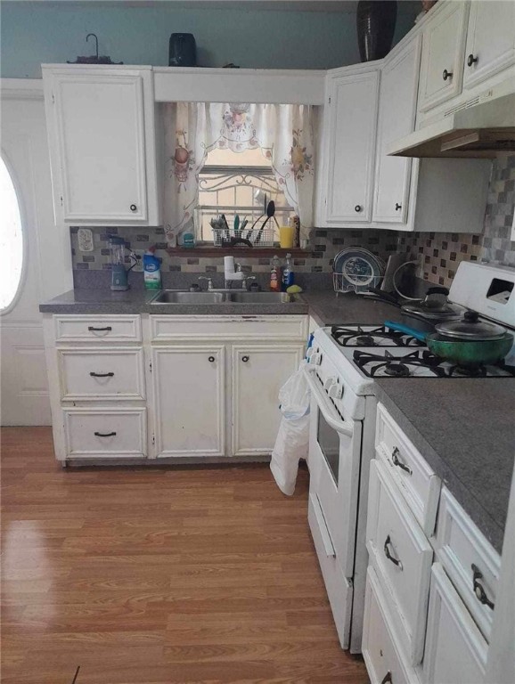2542 Ave F Ingleside, TX 78362 - Photo 9 of 19 a kitchen with granite countertop white cabinets and white appliances