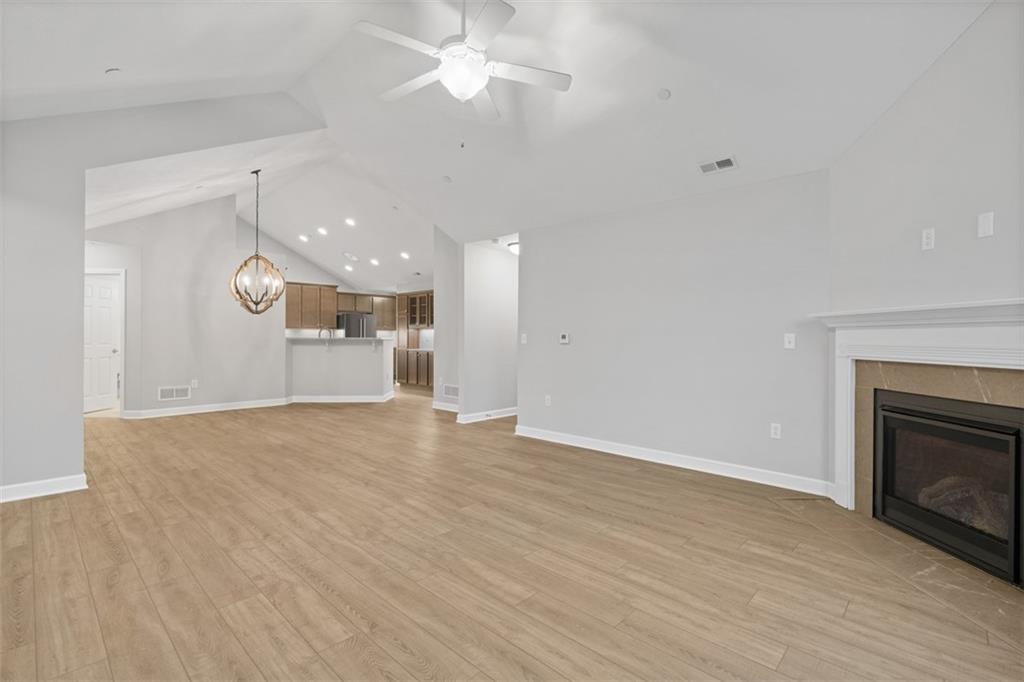 103 Spring Valley Drive Zelienople, PA 16063 - Photo 18 of 42 wooden floor in an empty room with a fireplace