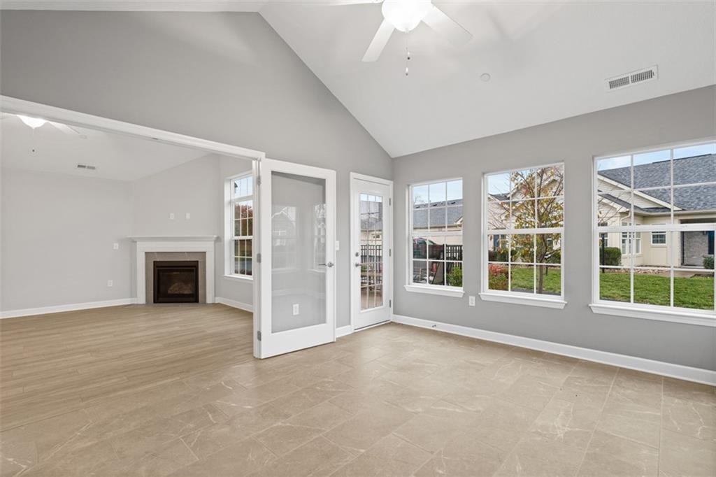 103 Spring Valley Drive Zelienople, PA 16063 - Photo 22 of 42 an empty room with windows and fireplace