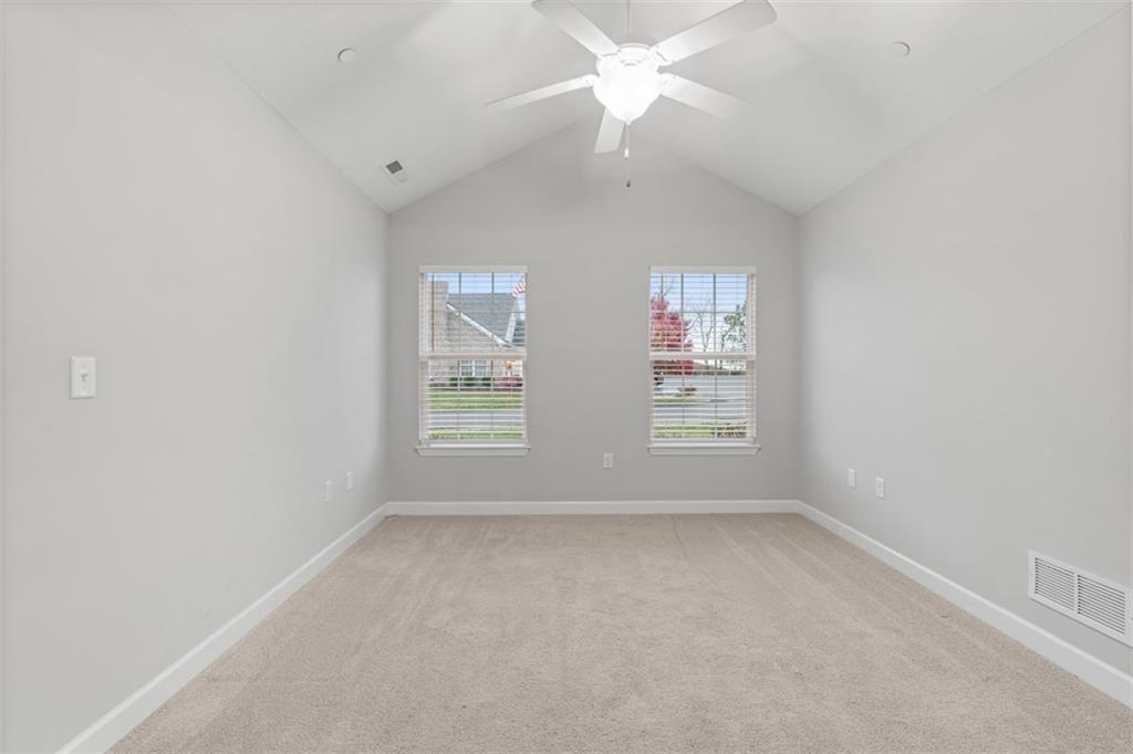 103 Spring Valley Drive Zelienople, PA 16063 - Photo 24 of 42 an empty room with windows and fan
