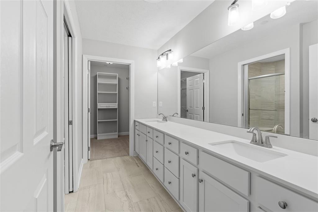 103 Spring Valley Drive Zelienople, PA 16063 - Photo 29 of 42 a spacious bathroom with a double vanity sink mirror and double