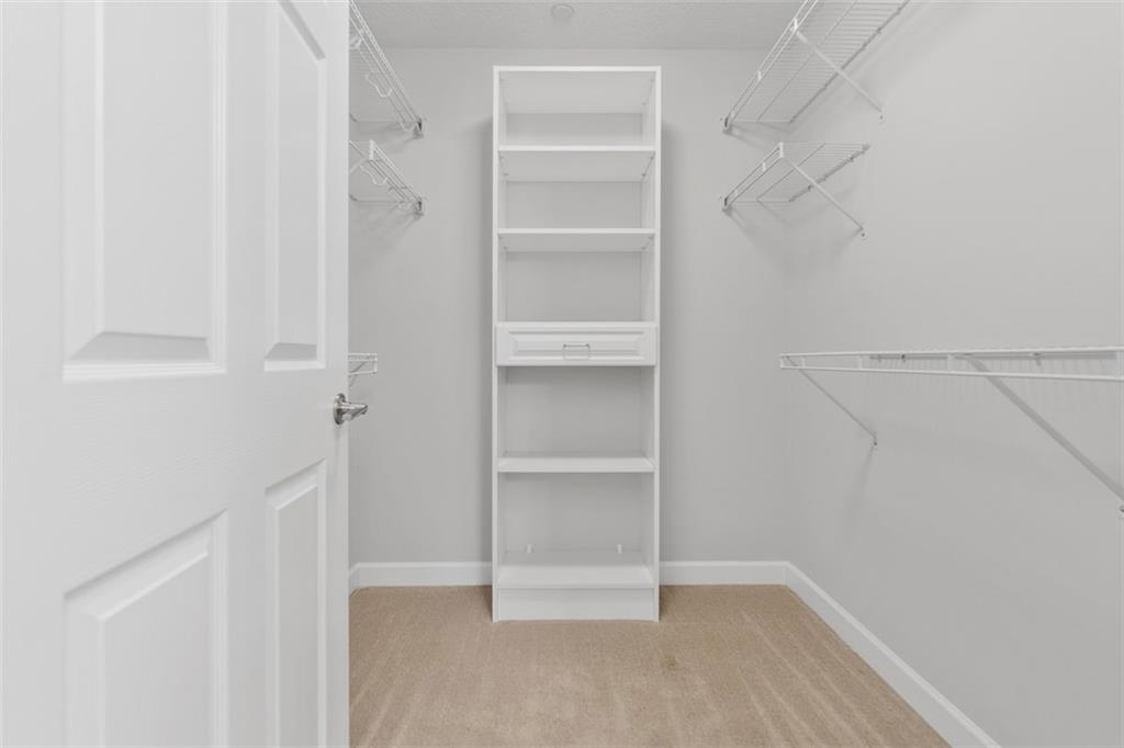 103 Spring Valley Drive Zelienople, PA 16063 - Photo 31 of 42 a view of walk in closet with empty racks