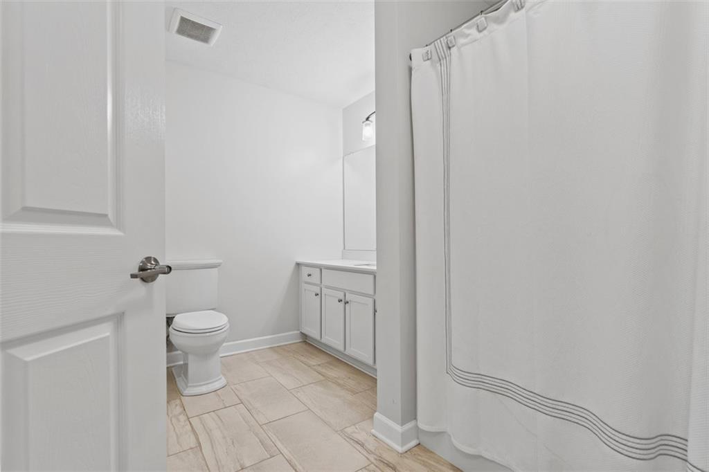 103 Spring Valley Drive Zelienople, PA 16063 - Photo 35 of 42 a bathroom with a granite countertop toilet and a sink