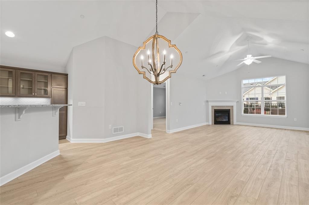 103 Spring Valley Drive Zelienople, PA 16063 - Photo 6 of 42 a view of empty room with wooden floor and fireplace