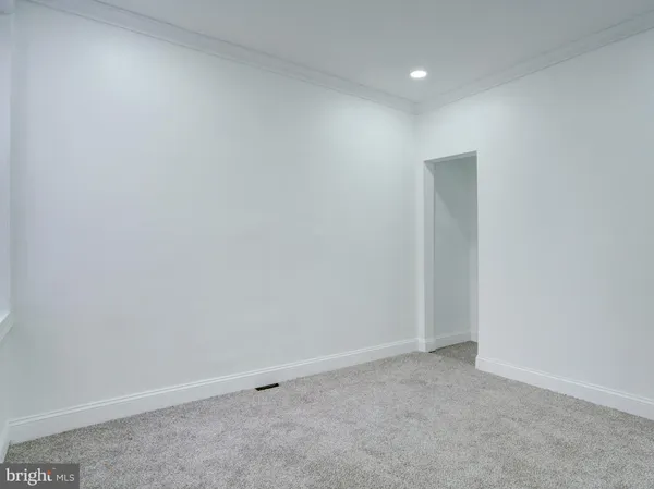 an empty room with closet area