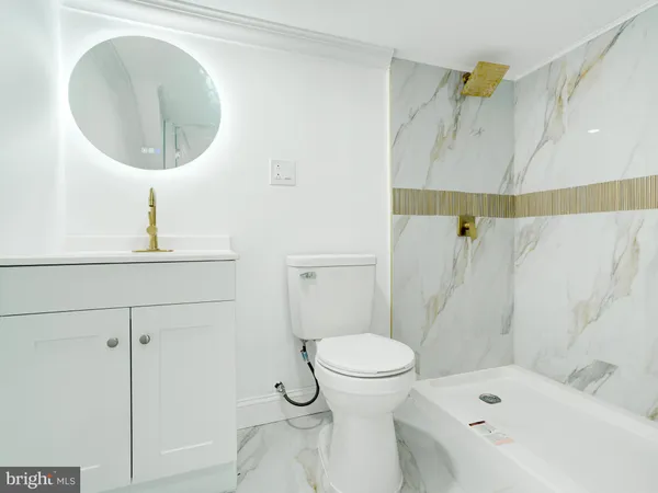 a bathroom with a bathtub and shower