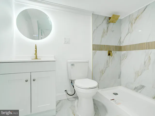 a bathroom with a bathtub and shower