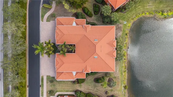 an aerial view of a house with a yard