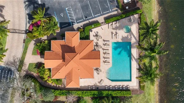 an aerial view of a house with a garden and swimming pool