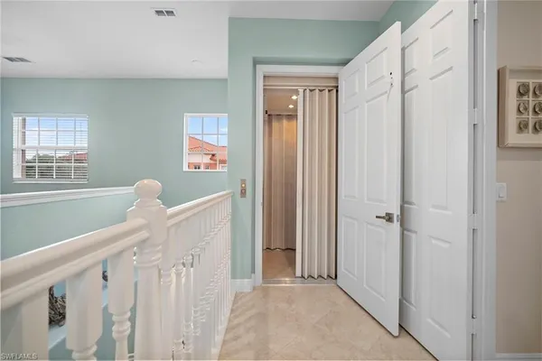 a view of a hallway with windows