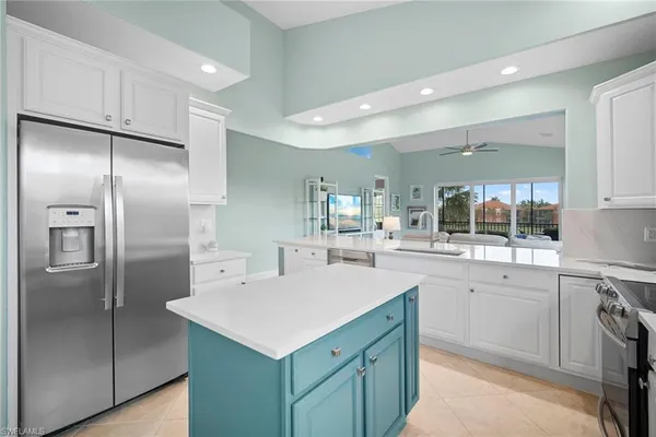 a kitchen with a sink stainless steel appliances and cabinets