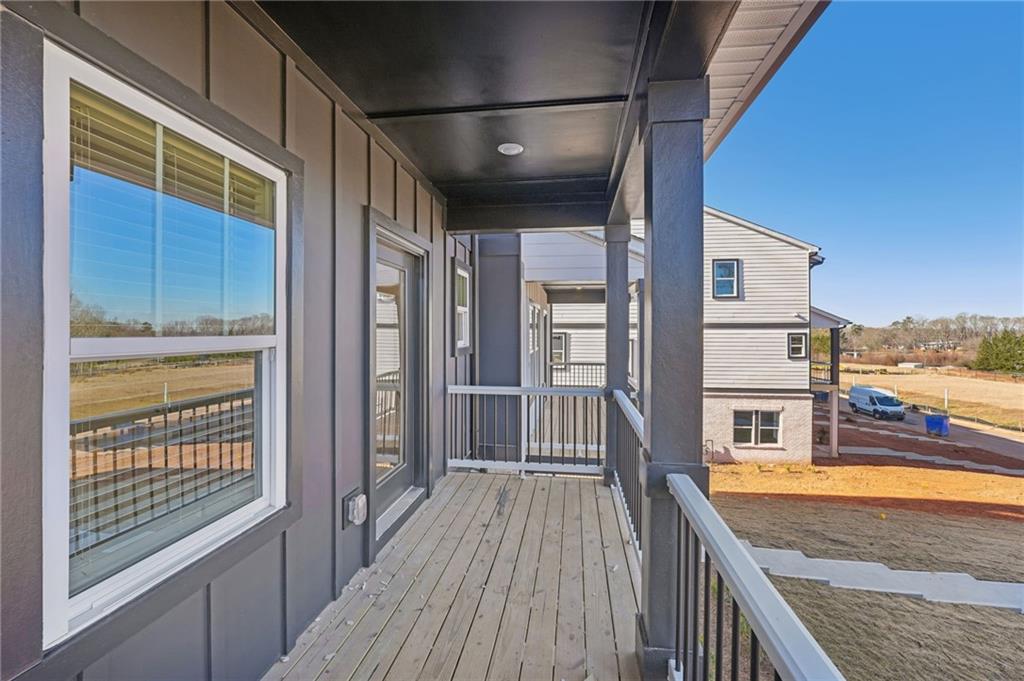 6440 Pinin Place Cumming, GA 30041 - Photo 7 of 52 a balcony with a city view