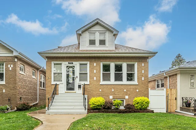 front view of a house with a yard