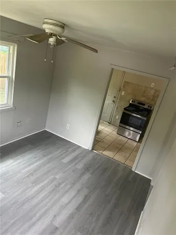 an empty room with wooden floor