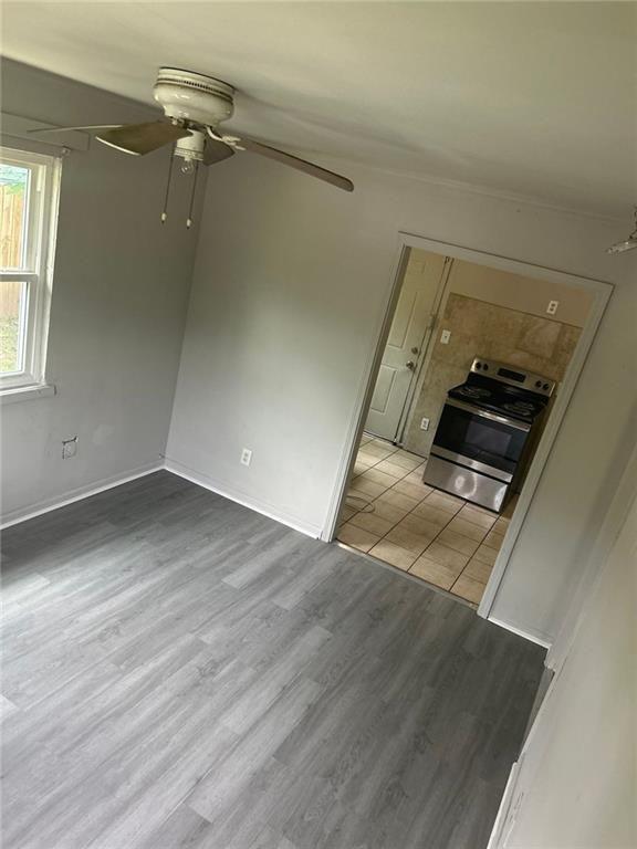 757 Coleman Street Southwest, Unit A Atlanta, GA 30310 - Photo 4 of 13 an empty room with wooden floor