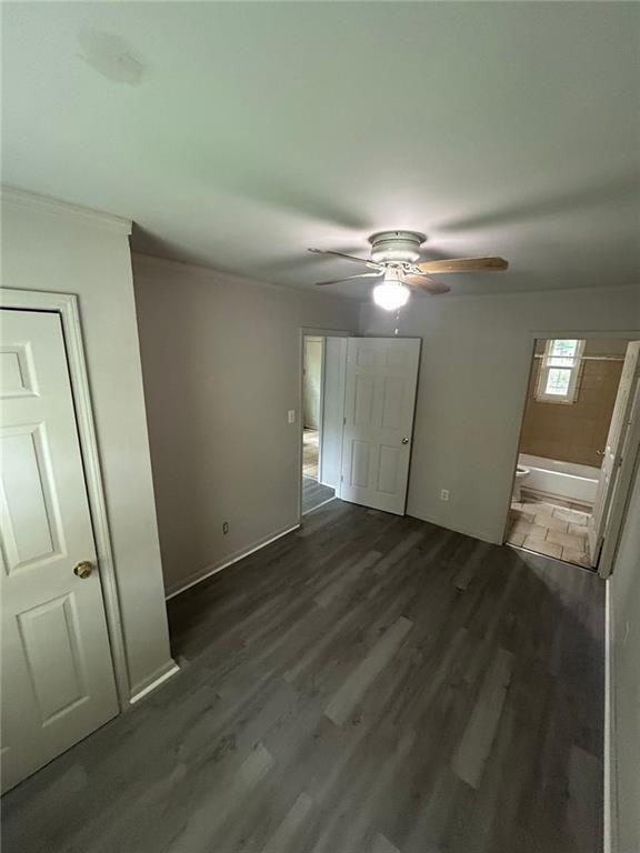 757 Coleman Street Southwest, Unit A Atlanta, GA 30310 - Photo 7 of 13 an empty room with wooden floor and mirror