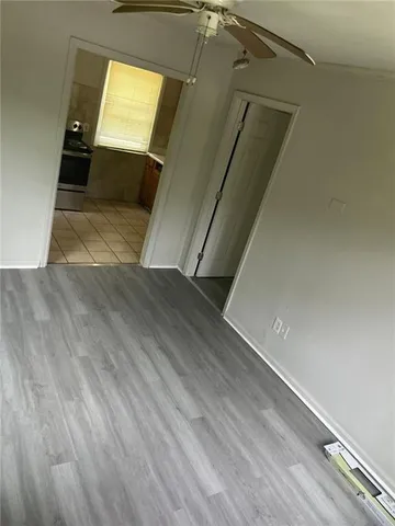 a view of a hallway view with wooden floor and staircase