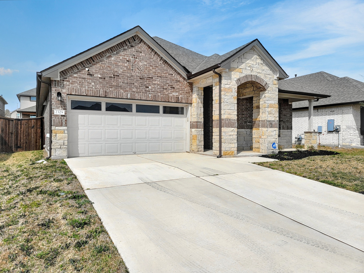 2329 Gabriels Horn Road Leander, TX 78641 - Photo 23 of 23 A welcoming stone and brick facade creates inviting curb appeal for this contemporary residence.