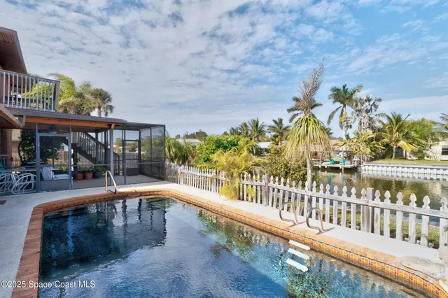 a view of a swimming pool with an outdoor seating