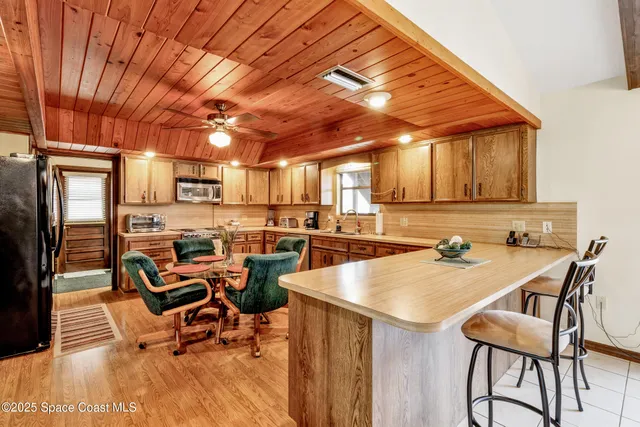 a dinning table and chairs in a room