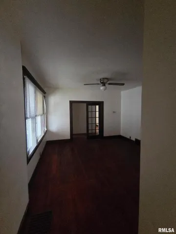 a view of an empty room and window