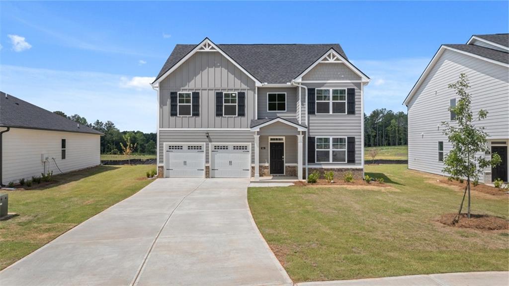 307 Friendship Oak Way Hampton, GA 30228 - Photo 1 of 35 a front view of a house with a yard