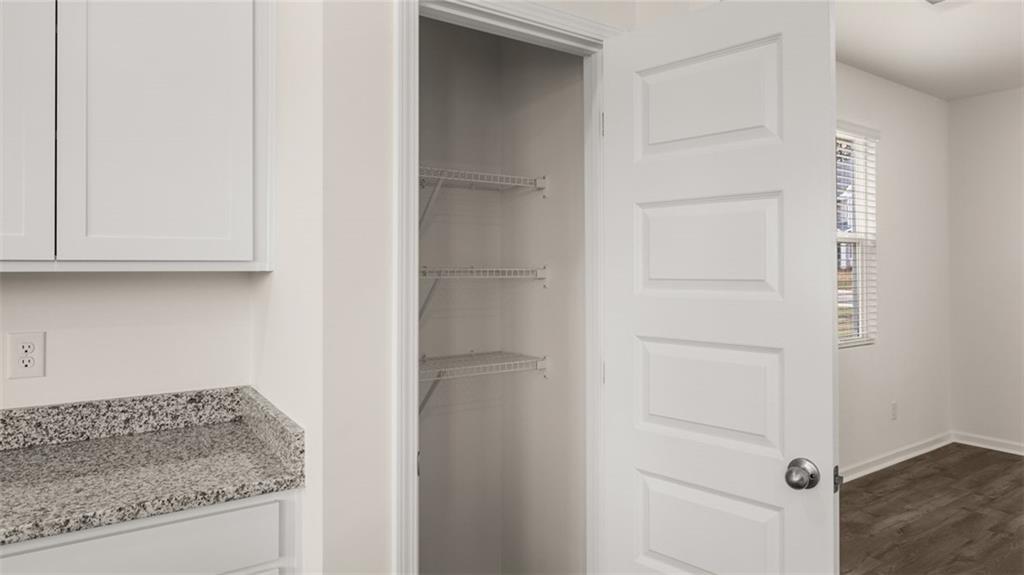 307 Friendship Oak Way Hampton, GA 30228 - Photo 11 of 35 a bathroom with a granite countertop cabinets and a sink