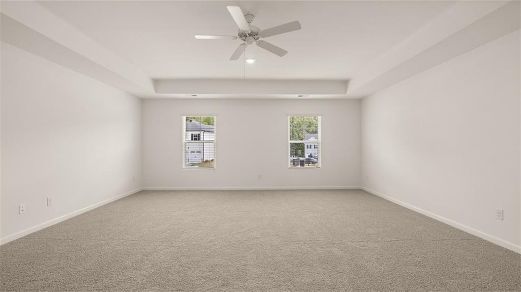 307 Friendship Oak Way Hampton, GA 30228 - Photo 17 of 35 an empty room with a window and a ceiling fan