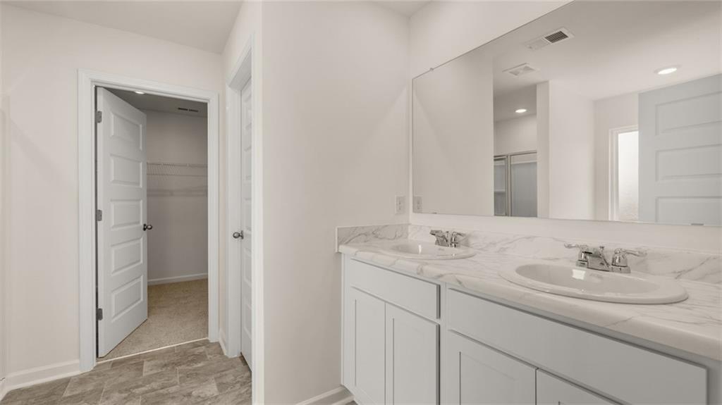 307 Friendship Oak Way Hampton, GA 30228 - Photo 19 of 35 a bathroom with a sink and a mirror