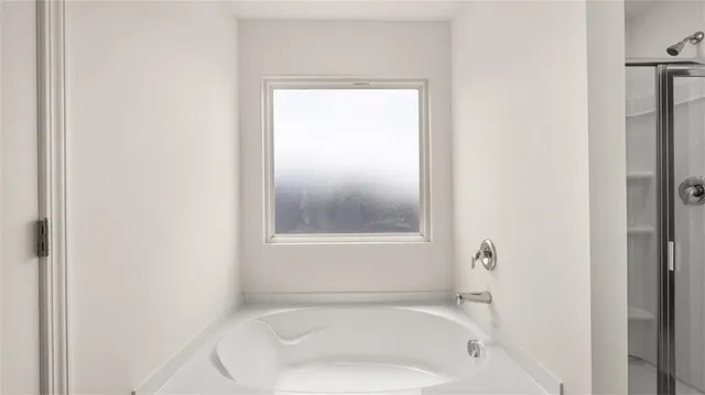 a bathroom with a glass shower door