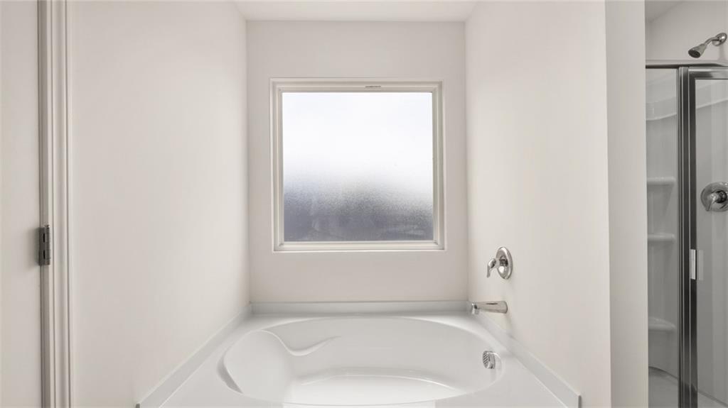 307 Friendship Oak Way Hampton, GA 30228 - Photo 21 of 35 a white bath tub sitting next to a white sink