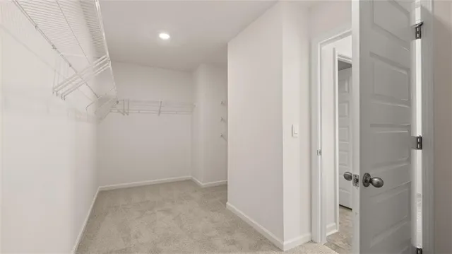 a view of hallway with closet