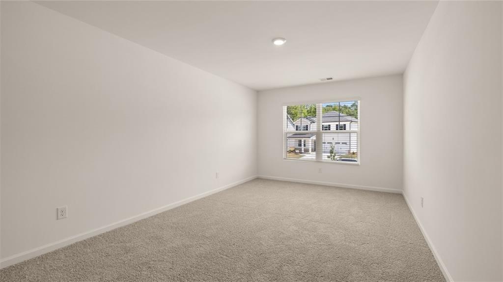 307 Friendship Oak Way Hampton, GA 30228 - Photo 28 of 35 an empty room with windows