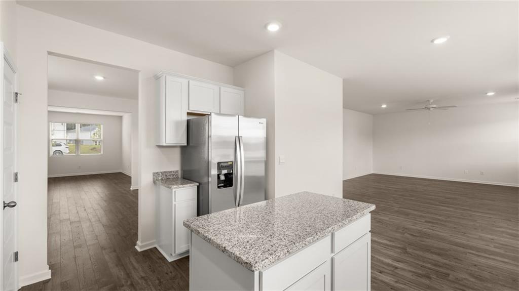 307 Friendship Oak Way Hampton, GA 30228 - Photo 9 of 35 a kitchen with stainless steel appliances granite countertop a refrigerator and a sink