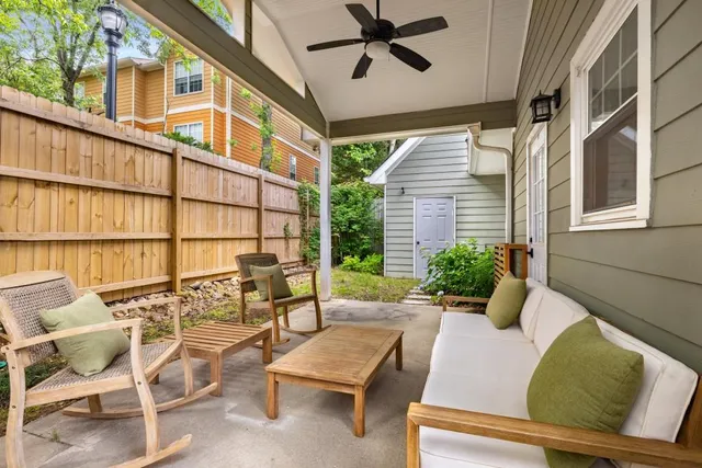 a view of an outdoor sitting area with furniture
