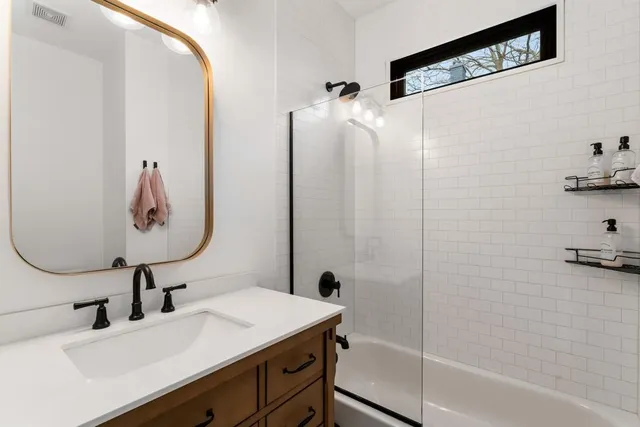 a bathroom with a sink and mirror