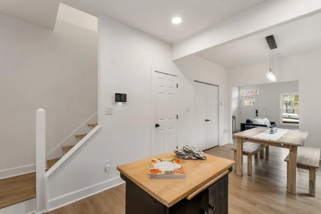 a view of a dining room with furniture and wooden floor
