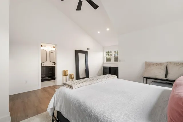 a bedroom with a bed and a television