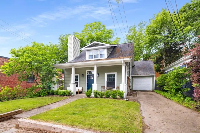 a view of an house with backyard space and garden