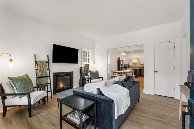 a view of a livingroom with furniture and a fireplace