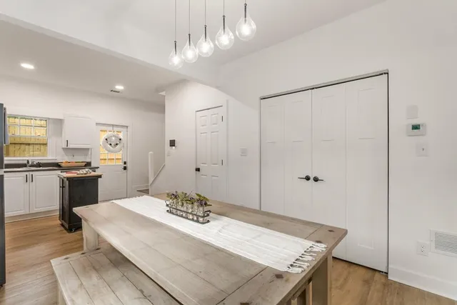 a view of a kitchen and dining table