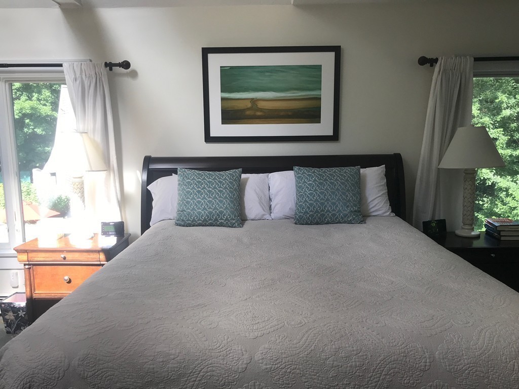 6 Popes Lane Hingham, MA 02043 - Photo 17 of 29 a bedroom with a bed and a painting on the wall