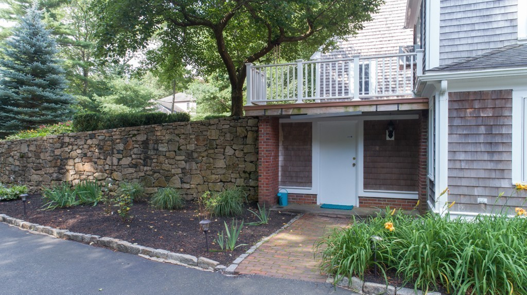 6 Popes Lane Hingham, MA 02043 - Photo 5 of 29 a front view of a house with garden
