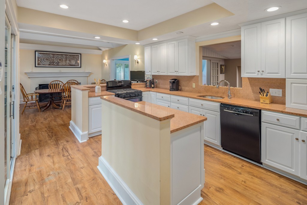 6 Popes Lane Hingham, MA 02043 - Photo 9 of 29 a kitchen with a sink a counter top space and stainless steel appliances