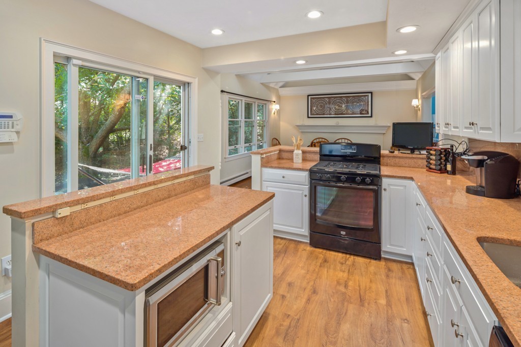 6 Popes Lane Hingham, MA 02043 - Photo 10 of 29 a kitchen with a stove and a sink