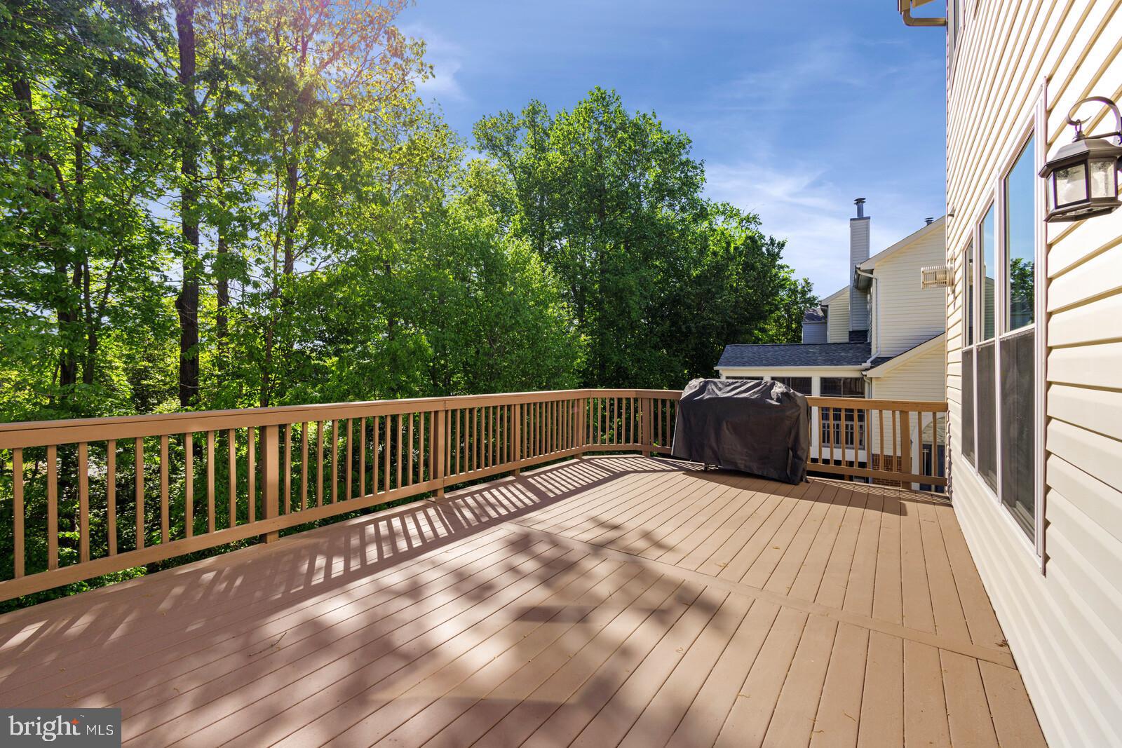 20713 Riptide Square Sterling, VA 20165 - Photo 27 of 65 a view of balcony with wooden floor and fence